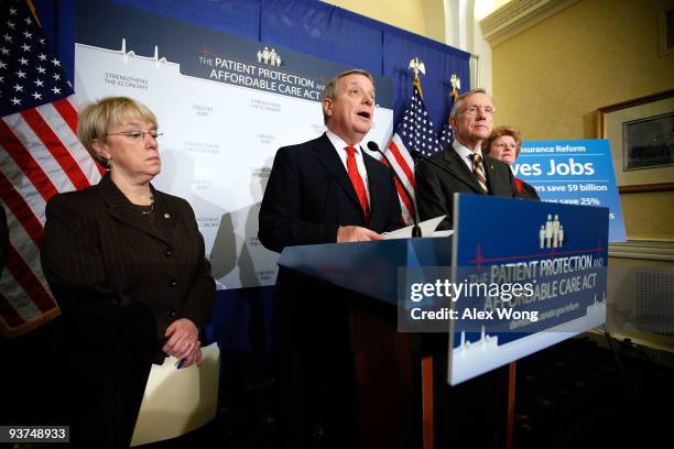 Senate Majority Whip Sen. Richard Durbin speaks as Sen. Patty Murray , Senate Majority Leader Harry Reid , and Sen. Debbie Stabenow listen during a...