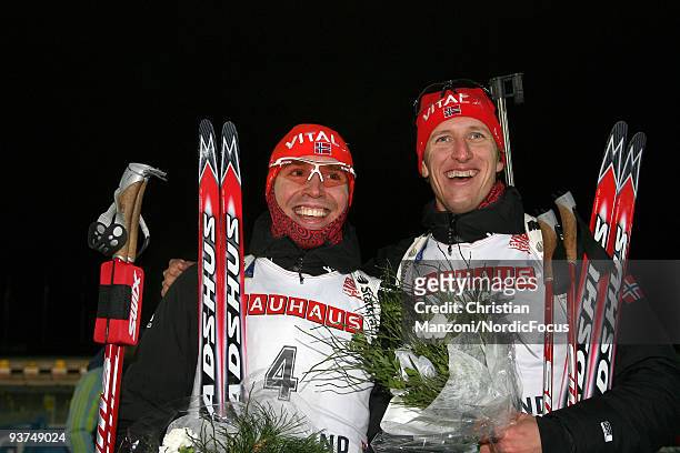 Emil Hegle Svendsen of Norway and Lars Berger of Norway smile after the Men's 20 km Individual event in the E.ON Ruhrgas IBU Biathlon World Cup on...