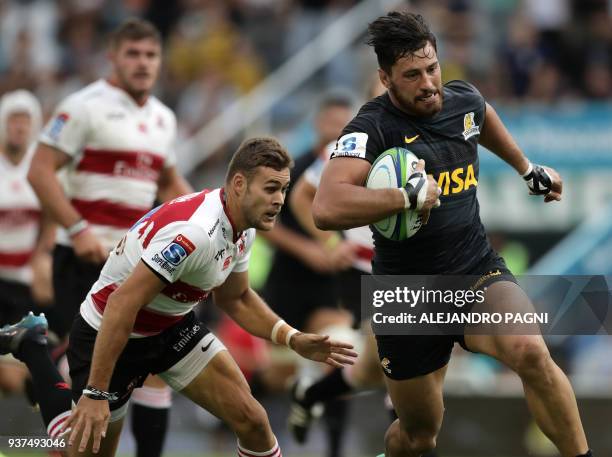 Argentina's Jaguares N8 Javier Ortega Desio runs to score a try against South Africa's Lions during their Super Rugby match at Jose Amalfitani...