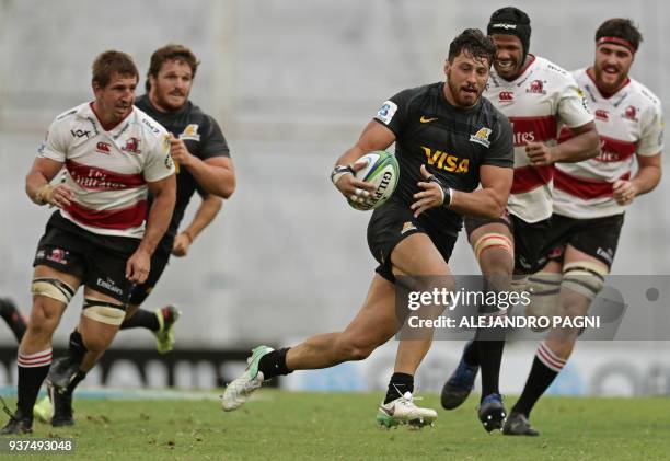 Argentina's Jaguares N8 Javier Ortega Desio runs to score a try against South Africa's Lions during their Super Rugby match at Jose Amalfitani...