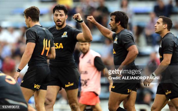 Argentina's Jaguares N8 Javier Ortega Desio celebrates with teammates after scoring a try against South Africa's Lions during their Super Rugby match...