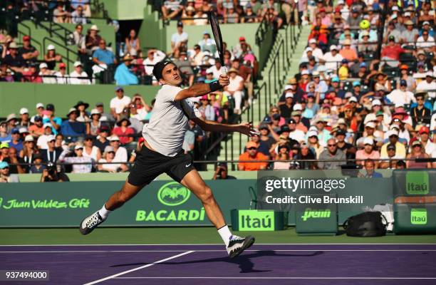 Roger Federer of Switzerland plays a forehand volley against Thanasi Kokkinakis of Australia in their second round match during the Miami Open...