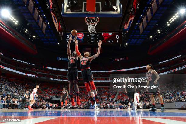 Noah Vonleh and Denzel Valentine of the Chicago Bulls reach for the ball during the game against the Detroit Pistons on March 24, 2018 at Little...