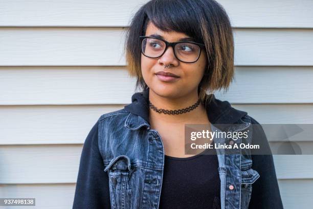 teenage girl wearing glasses looking at camera - choker stock pictures, royalty-free photos & images