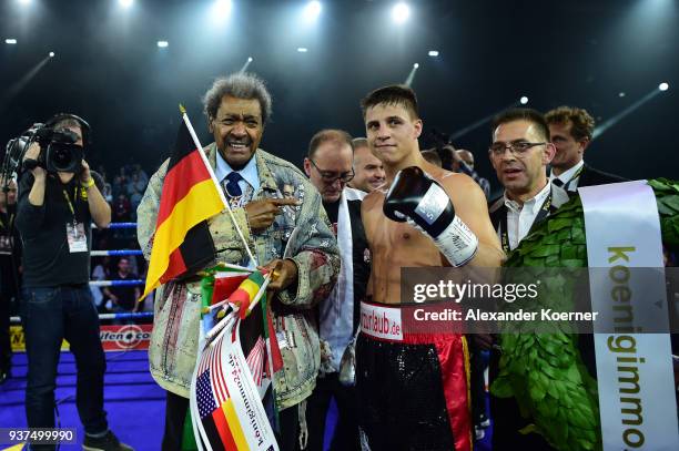 Tyron Zeuge and Don King celebrates the victory over Isaac Ekpo at the Inselparkhalle Arena on March 24, 2018 in Hamburg, Germany.