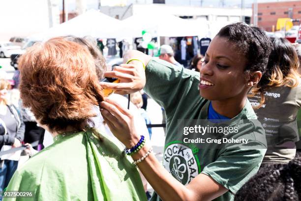 Actress Angelique Bates shaves a head at the St. Baldrick's Foundation Celebrity Event on March 24, 2018 in North Hollywood, California.