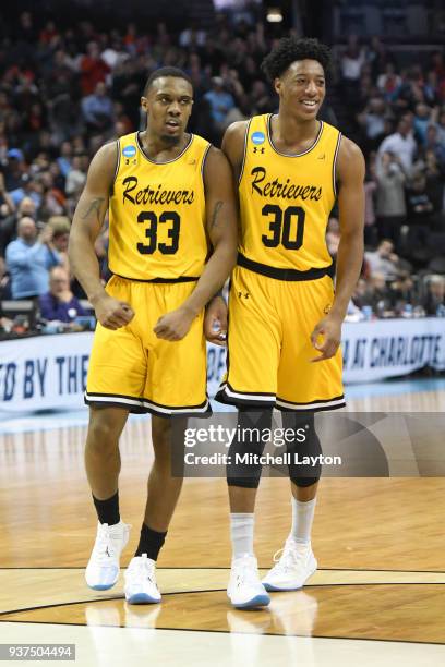 Arkel Lamar and Daniel Akin of the UMBC Retrievers celebrate a basket during the first round of the 2018 NCAA Men's Basketball Tournament against the...