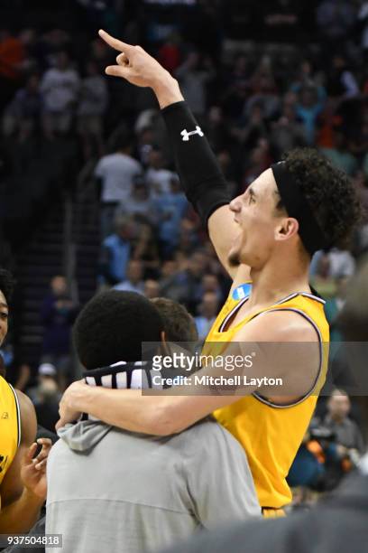 Maura of the UMBC Retrievers celebrates a win after the first round of the 2018 NCAA Men's Basketball Tournament against the Virginia Cavaliers at...