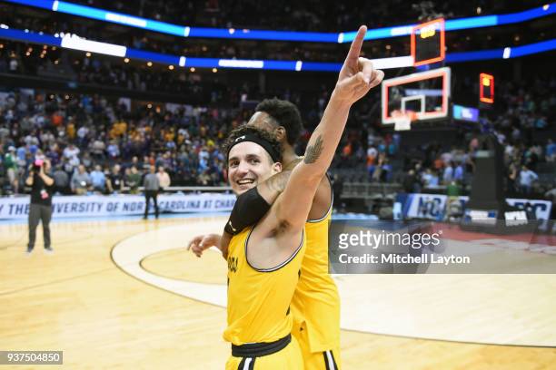 Maura of the UMBC Retrievers celebrates a win after the first round of the 2018 NCAA Men's Basketball Tournament against the Virginia Cavaliers at...
