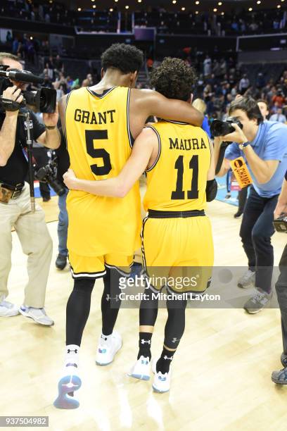 Maura of the UMBC Retrievers celebrates a with Jourdan Grant after the first round of the 2018 NCAA Men's Basketball Tournament against the Virginia...