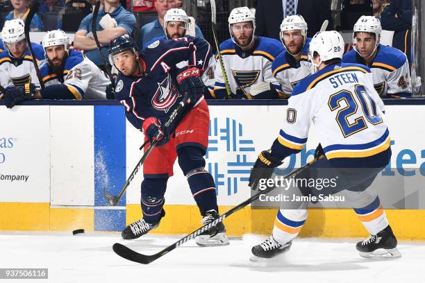 Seth Jones of the Columbus Blue Jackets passes the puck away from Alexander Steen of the St. Louis Blues during the first period of a game on March...