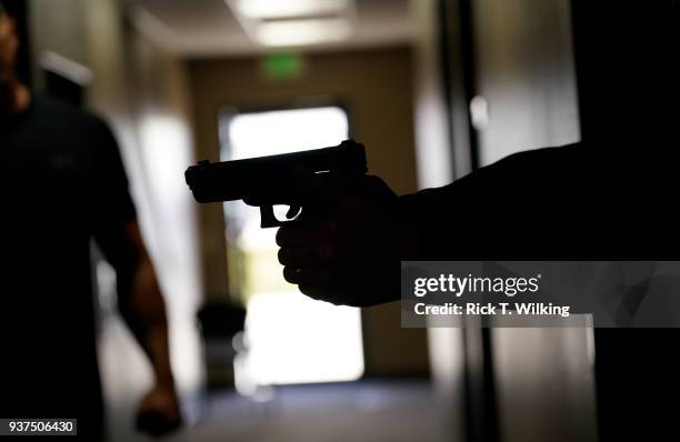 Joe Deedon, former law enforecement officer and owner of Tac*One Consulting , coaches a student in Deedon's "Lone Wolf" civilian active shooter...