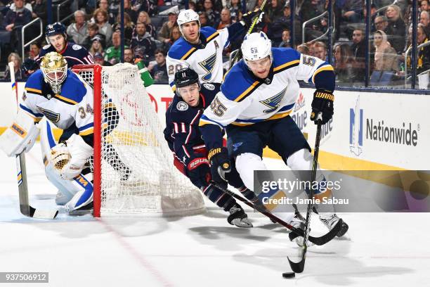 Colton Parayko of the St. Louis Blues attempts to keep the puck from Matt Calvert of the Columbus Blue Jackets during the first period of a game on...