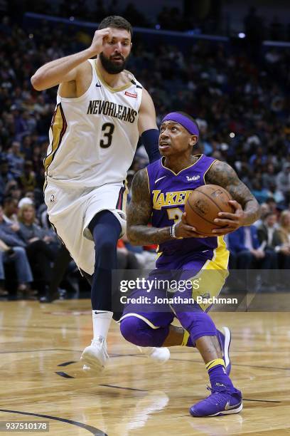 Isaiah Thomas of the Los Angeles Lakers drives against Nikola Mirotic of the New Orleans Pelicans during the first half at the Smoothie King Center...