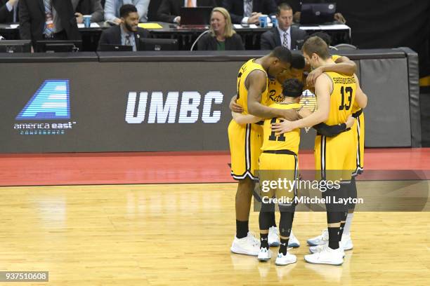 The UMBC Retrievers huddle before the first round of the 2018 NCAA Men's Basketball Tournament against the Virginia Cavaliers at the Spectrum Center...