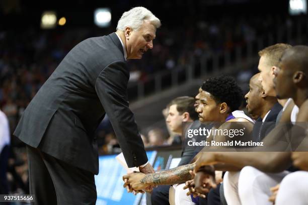 Head coach Bruce Weber of the Kansas State Wildcats speaks to Cameron Satterwhite on the bench in the second half against the Loyola Ramblers during...