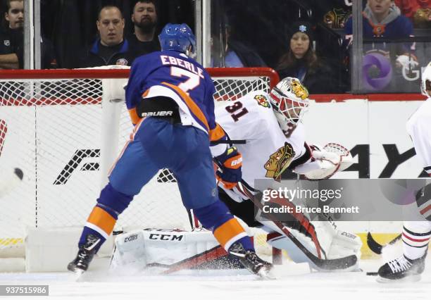 Anton Forsberg of the Chicago Blackhawks makes the first period stop as Jordan Eberle of the New York Islanders looks for the rebound at the Barclays...