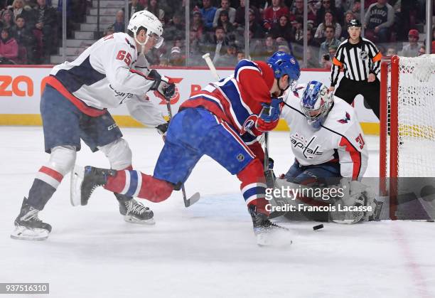 Philipp Grubauer of the Washington Capitals makes a save in front of Artturi Lehkonen of the Montreal Canadiens in the NHL game at the Bell Centre on...