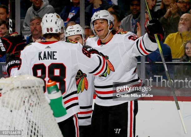 Brandon Saad of the Chicago Blackhawks celebrates his second-period goal against the New York Islanders with teammates Patrick Kane and Alex...