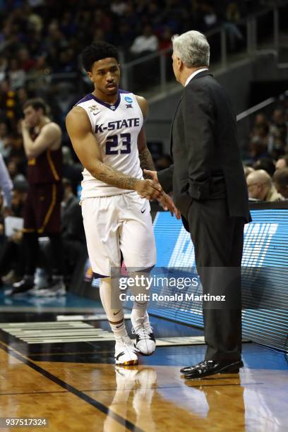 Head coach Bruce Weber shakes hands with Amaad Wainright of the Kansas State Wildcats as he comes off the court in his teams defeat to the Loyola...