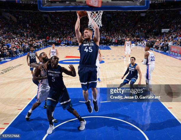Cole Aldrich of the Minnesota Timberwolves grabs the rebound against the Philadelphia 76ers at Wells Fargo Center on March 24, 2018 in Philadelphia,...