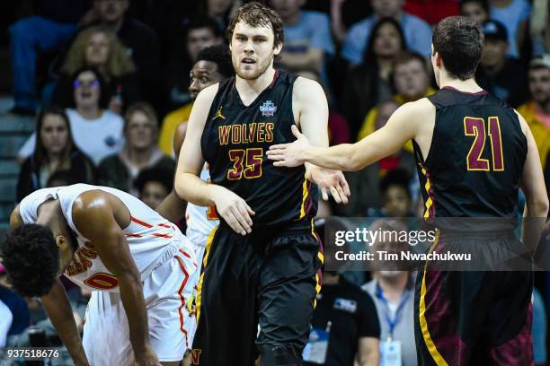 Logan Doyle and Gabe King of Northern State University high five during the Division II Men's Basketball Championship held at the Sanford Pentagon on...