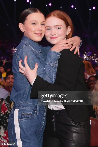 Millie Bobby Brown and Sadie Sink onstage at Nickelodeon's 2018 Kids' Choice Awards at The Forum on March 24, 2018 in Inglewood, California.