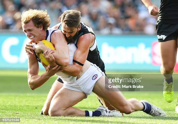 David Mundy of the Dockers caught by Justin Westhoff of Port Adelaide during the round one AFL match between the Port Adelaide Power and the...
