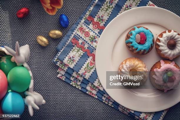 small easter bunt cakes with icing and sweets - bunt cake stock pictures, royalty-free photos & images