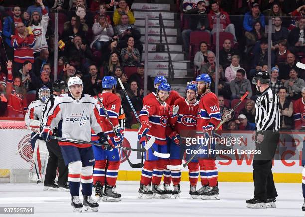 Charles Hudon of the Montreal Canadiens celebrates with teammates after scoring a goal against the Washington Capitals in the NHL game at the Bell...
