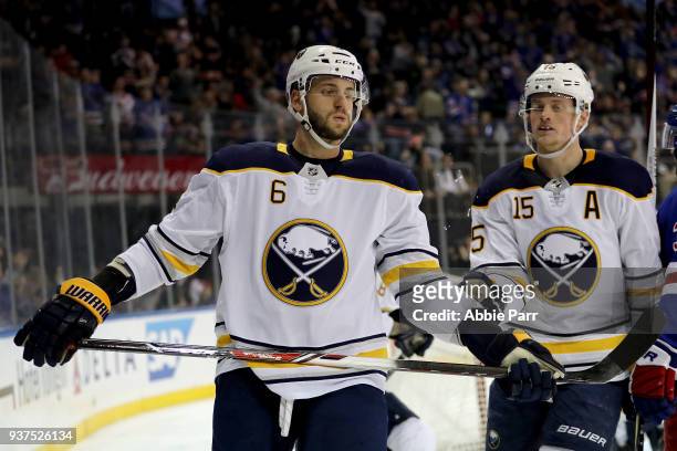 Marco Scandella and Jack Eichel of the Buffalo Sabres react after a goal by the New York Rangers in the second period during their game at Madison...