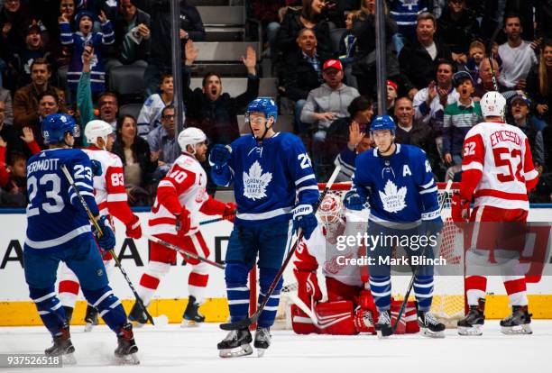 Connor Brown of the Toronto Maple Leafs celebrates his goal on Jimmy Howard of the Detroit Red Wings with teammates Travis Dermott and Tyler Bozak...