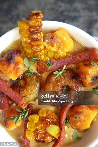 smoked bacon and sweetcorn chowder - flat leaf parsley stock pictures, royalty-free photos & images