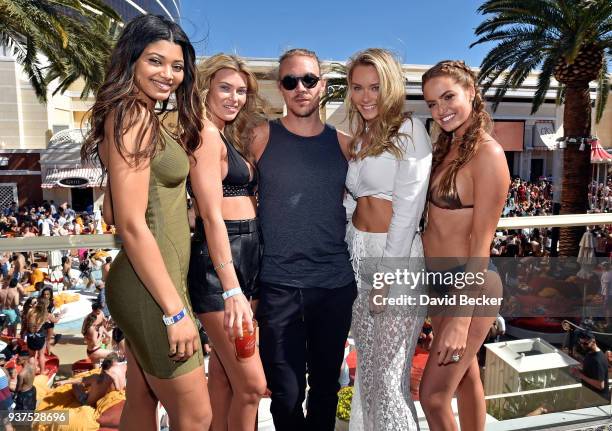 Models Danielle Herrington, Samantha Hoopes, DJ Diplo, models Camille Kostek and Haley Kalil attend Sports Illustrated Swimsuit new issue launch and...