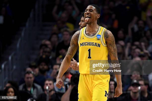 Charles Matthews of the Michigan Wolverines reacts after he dunks the ball in the first half against the Florida State Seminoles in the 2018 NCAA...