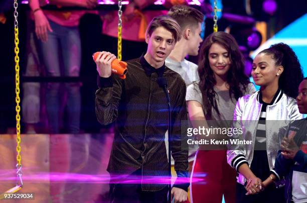 Jace Norman accepts the Favorite TV Actor award for 'Henry Danger' from Owen Joyner, Lilimar Hernandez and Daniella Perkins onstage at Nickelodeon's...