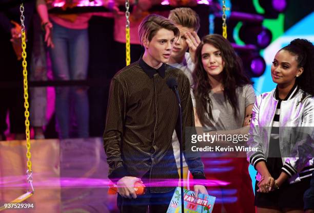 Jace Norman accepts the Favorite TV Actor award for 'Henry Danger' from Owen Joyner, Lilimar Hernandez and Daniella Perkins onstage at Nickelodeon's...