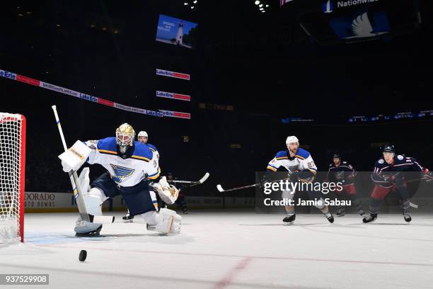 Goaltender Jake Allen of the St. Louis Blues skates back towards the net as Alex Pietrangelo of the St. Louis Blues and Matt Calvert of the Columbus...