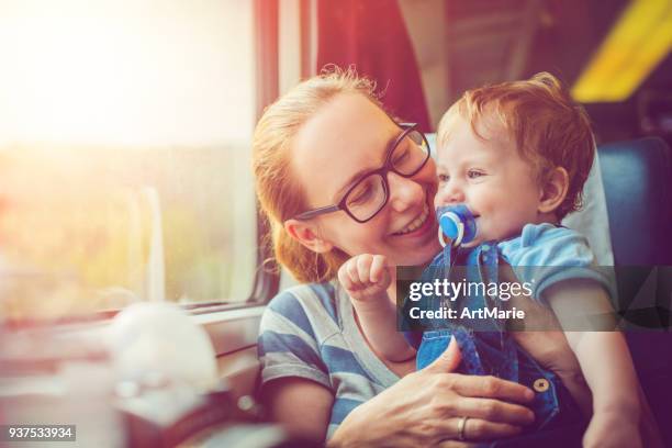 family traveling by train - vacation train stock pictures, royalty-free photos & images