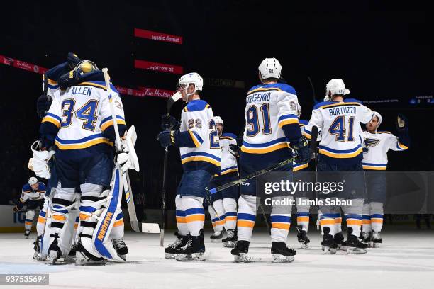 The St. Louis Blues celebrate with goaltender Jake Allen of the St. Louis Blues after defeating the Columbus Blue Jackets 2-1 in a game on March 24,...