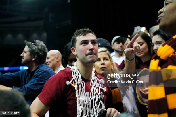 Ben Richardson of the Loyola Ramblers celebrates with his team after they defeated the Kansas State Wildcats in the 2018 NCAA Men's Basketball...