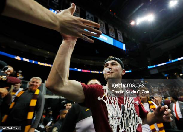 Ben Richardson of the Loyola Ramblers celebrates with his team after they defeated the Kansas State Wildcats in the 2018 NCAA Men's Basketball...