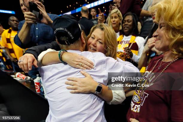 Head coach Porter Moser of the Loyola Ramblers celebrates with his family after his teams win over the Kansas State Wildcats during the 2018 NCAA...