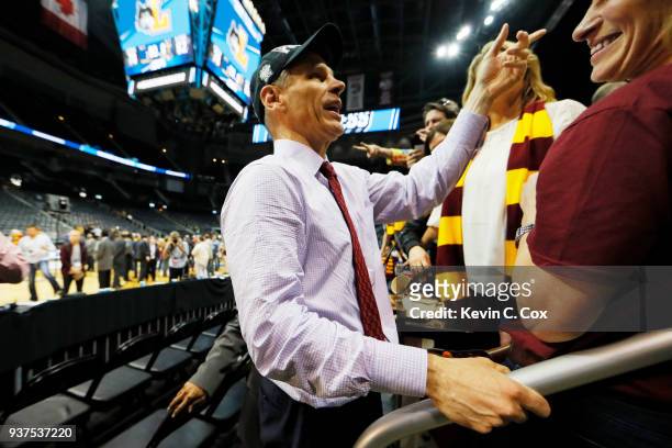 Head coach Porter Moser of the Loyola Ramblers celebrates with his family after his teams win over the Kansas State Wildcats during the 2018 NCAA...