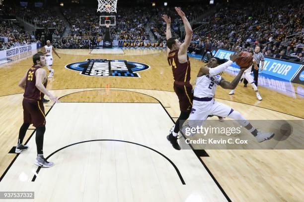 Cartier Diarra of the Kansas State Wildcats attempts a shot defended by Ben Richardson of the Loyola Ramblers in the second half during the 2018 NCAA...