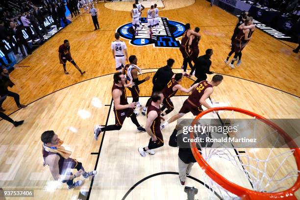 The Loyola Ramblers celebrate after defeating the Kansas State Wildcats during the 2018 NCAA Men's Basketball Tournament South Regional at Philips...