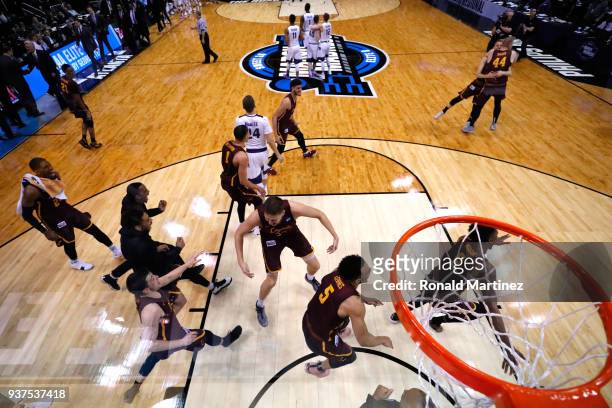 The Loyola Ramblers celebrate after defeating the Kansas State Wildcats during the 2018 NCAA Men's Basketball Tournament South Regional at Philips...