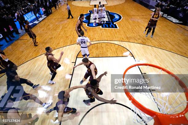 The Loyola Ramblers celebrate after defeating the Kansas State Wildcats during the 2018 NCAA Men's Basketball Tournament South Regional at Philips...