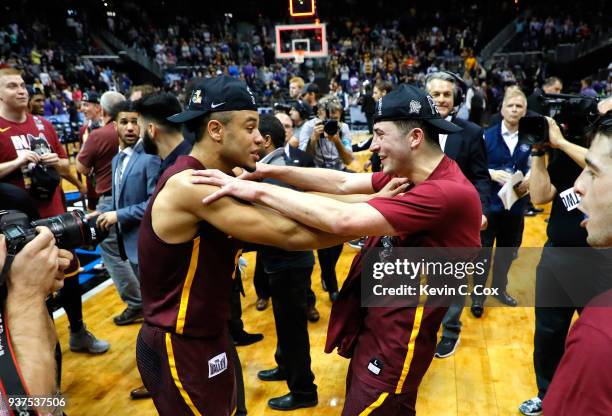 Marques Townes and Ben Richardson of the Loyola Ramblers celebrate after defeating the Kansas State Wildcats during the 2018 NCAA Men's Basketball...