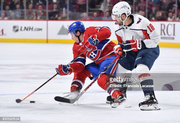 Brendan Gallagher of the Montreal Canadiens controls the puck while being challenged by Chandler Stephenson of the Washington Capitals, on his 400th...